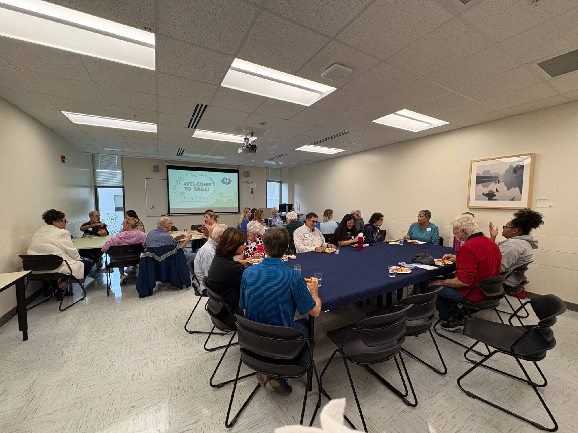 SAGE and Grand Connections members talking to each other in small groups